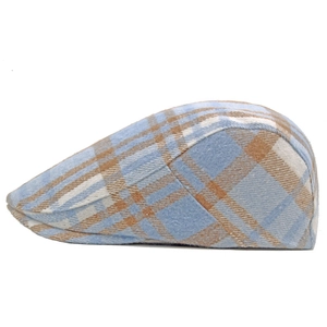 Side view of blue and beige plaid wool ivy cap showing retro British peak detail