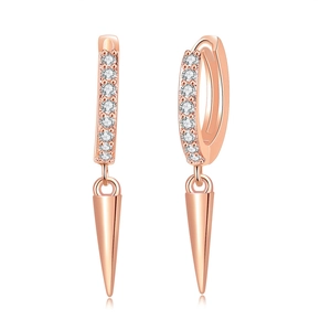 Detail of rose gold hoop earrings featuring micro-pave zircons and polished cone pendants