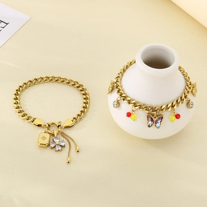 Detail of gold-plated stainless steel NK chain bracelets with crystal butterfly charms