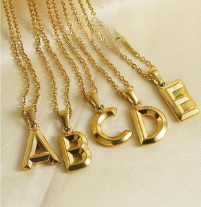 Detail of 18K gold-plated stainless steel 3D capital letter pendants with O-chains
