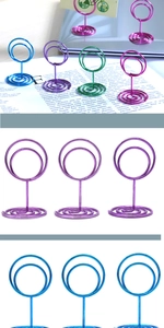 Macro detail of colorful spiral wire place card holders in blue, purple and green