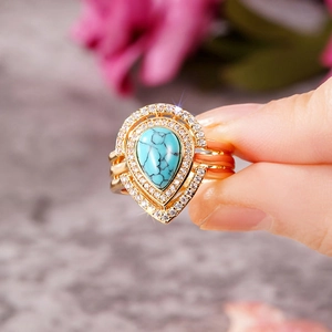 Bohemian gold ring with pear-shaped turquoise stone and multi-layer diamond band