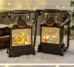 Detail of vintage Christmas phone lamp with spinning snow and Nativity scene