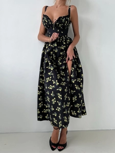Detail of floral slit dress featuring lemon prints and a high waist side opening