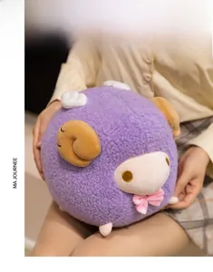 Close-up of a soft purple sheep plush toy with brown horns and a cute pink bow tie detail