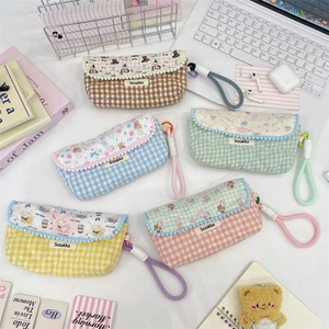 Detailed view of quilted floral pencil cases in five pastel colors with cute bear patterns