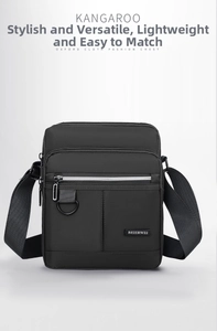 Detail view of durable Oxford fabric texture and metallic D-ring on black crossbody bag