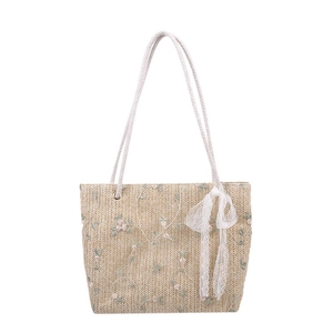 Handmade straw tote bag with floral embroidery, white cotton straps and lace bow