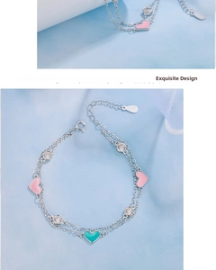 Close-up of double-layer S925 silver heart bracelet with pink enamel and clear zircon charms