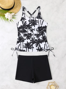 Flat lay of palm tree print tankini with drawstring sides and black boyshorts
