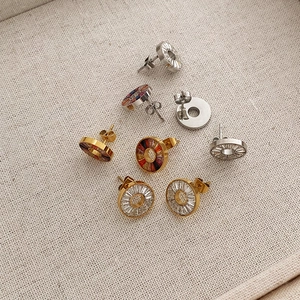 Elegant stainless steel round stud earrings with colorful cubic zirconia crystals