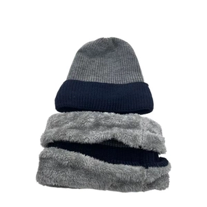 Detailed view of fleece-lined knitted winter beanie hat and matching neck warmer set