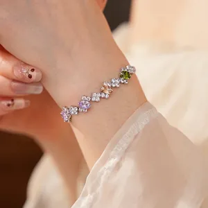 Irregular geometric bracelet with colorful pear-shaped zircons and silver plating