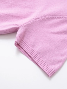 Macro detail of lavender knit fabric with ribbed cuffs and high-quality seam stitching
