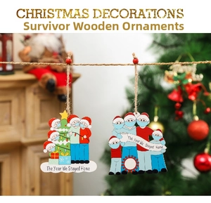 Detail of wooden Christmas tree survivor ornament with family wearing masks and masks design