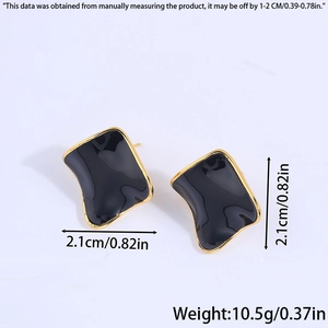 Detailed view of wave-shaped black and gold earrings with dimensions and weight info