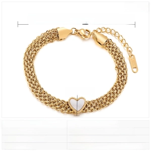 Macro view of multi-layer gold stainless steel chain with heart shell pendant detail