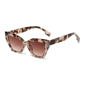 Tortoiseshell cat eye sunglasses with brown gradient lenses shown from a 45-degree angle