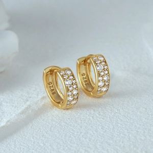 Macro detail of S925 hallmark on gold plated sterling silver double row huggie earrings