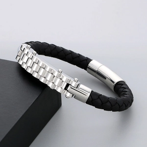 Detail of men's woven leather bracelet with stainless steel industrial style clasp
