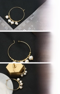 Detail of 18K gold plated hoop earrings featuring natural freshwater pearls and golden beads