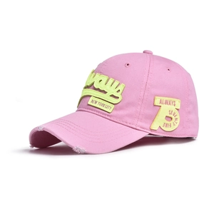 Detail of distressed pink cotton baseball cap with yellow New York City embroidery