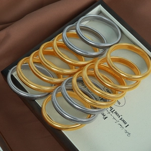 10mm vintage metallic coil bracelets in gold and silver finish with industrial spiral texture
