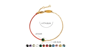 Detail of red string and gold titanium chain bracelet with various zircon stone colors