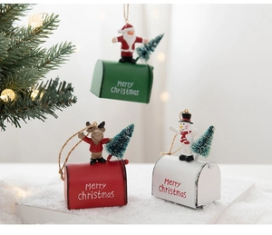 Detailed view of festive iron Christmas mailbox ornaments with reindeer and Santa figures