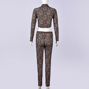 Rear view of pink two-piece set with black geometric pattern on a white mannequin