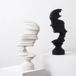 Modern abstract face sculptures in black and white finish for luxury home shelf decor