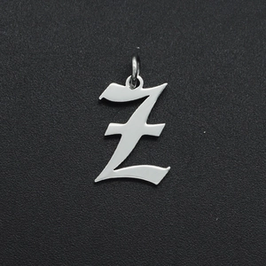 Macro detail of polished stainless steel gothic letter Z pendant with jump ring