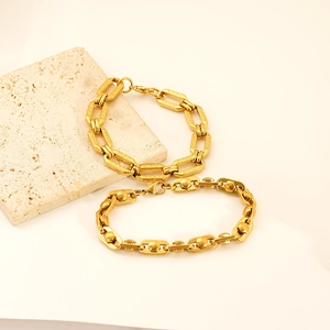 Luxurious 18K gold-plated stainless steel geometric link bracelets on stone display