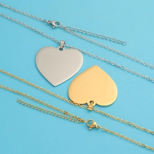Polished gold and silver heart-shaped pendant necklaces with adjustable chain extension