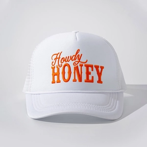 Detailed macro shot of white trucker hat featuring orange Howdy HONEY embroidery