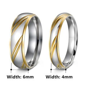 Two-tone gold and silver stainless steel couple rings with engraved feather pattern