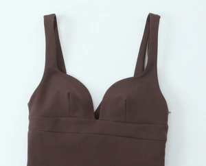 Detail view of the deep brown elastic V-neck crop top with fine stitching and soft texture