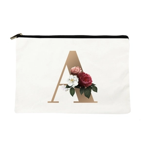 Floral canvas makeup bag featuring golden letter A and red flower patterns on white fabric