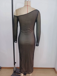 Detail of sheer black sequin bodycon dress with one-shoulder long sleeve design