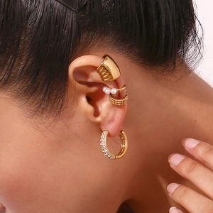 Gold double-row crystal earrings and pearl ear cuffs set on model's ear