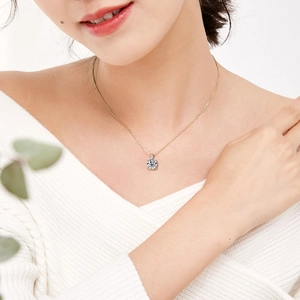Classic 1 carat moissanite 925 silver necklace in gold finish on female model