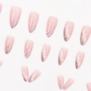Pink gradient almond press-on nails with silver glitter and white wavy line patterns