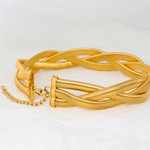 Detailed macro view of triple braided gold snake chain choker with adjustable lobster clasp