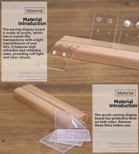 Detailed view of high-transparency acrylic earring display with natural wood base stand