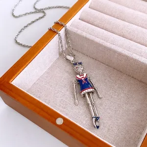 Vintage silver sailor doll pendant necklace with blue enamel and sparkling crystals