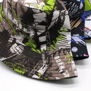 Tropical style bucket hat with graffiti palm leaf and neon lettering print on canvas