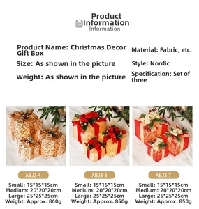Close-up of three plaid Christmas light-up gift boxes with pinecone and berry details