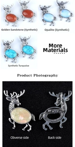 Detailed close-up of elk brooch pendant with assorted crystal stones and silver metal backing