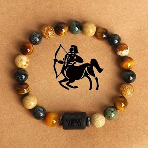 Natural tiger eye stone beaded Sagittarius zodiac bracelet on rustic textured card