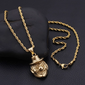 Detailed view of 3D clown pendant on a twisted rope chain over dark leather texture